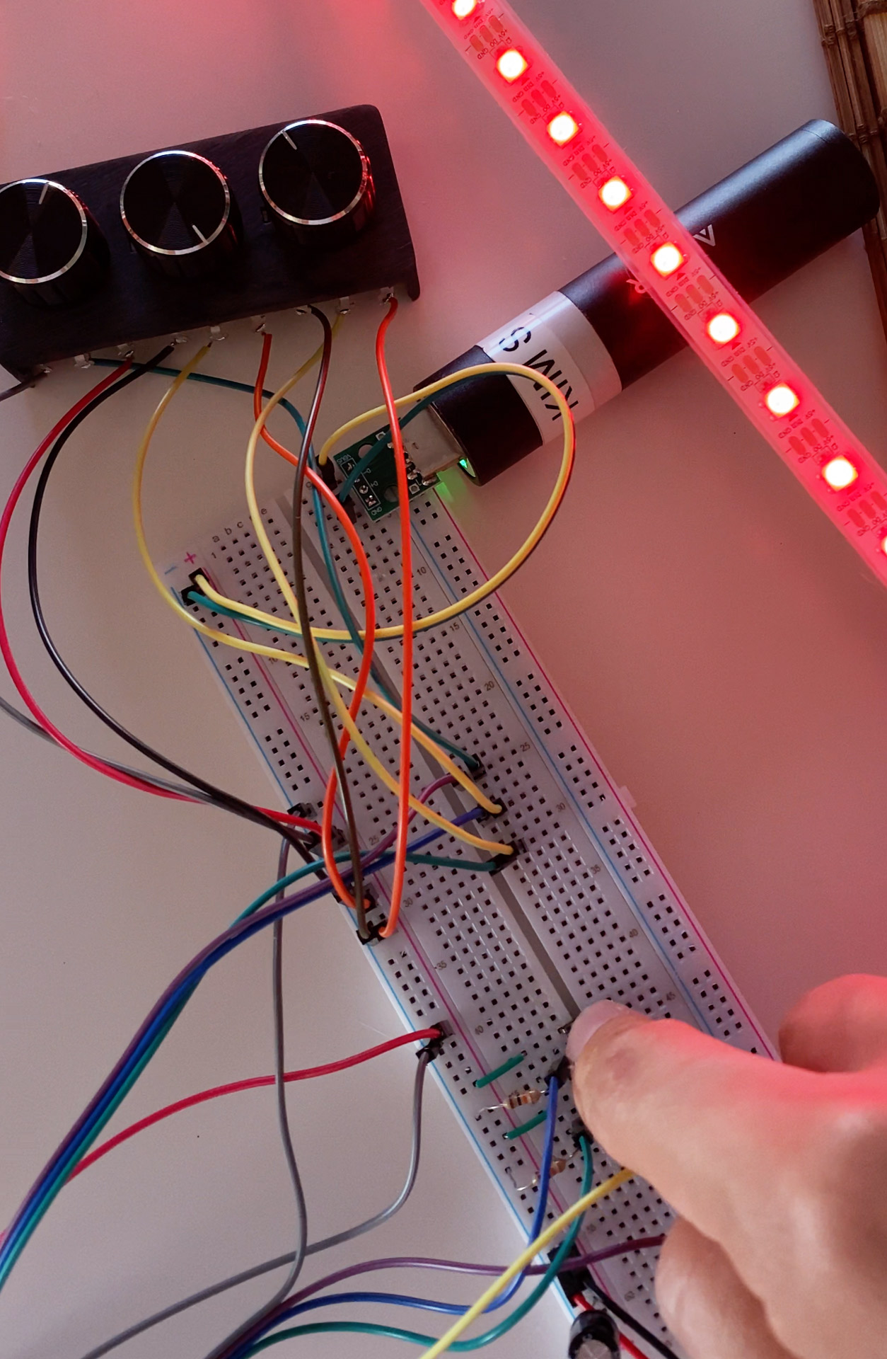Electronic components and LED strips laid out on workbench