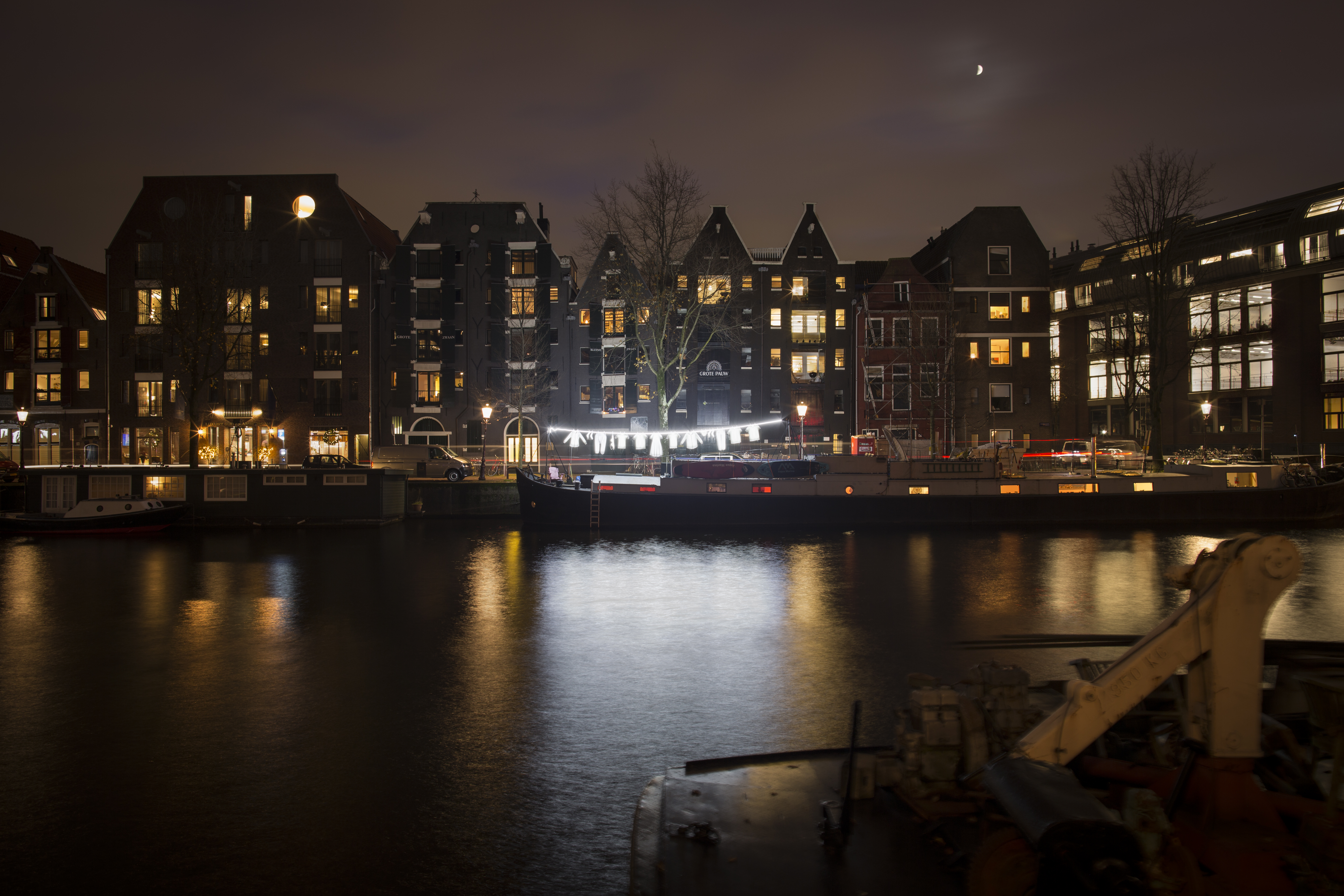 Glowing garments reflected in the Amsterdam canal